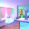 Soft ambient lighting design provides colorful tones to event