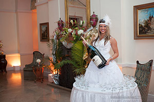 Human table with giant champagne glass at sweet 16 party